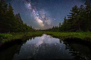 Night landscape in Acadia National Park with reflection of the Milky Way and dozens of fireflies. Photo by Rolando C. Prol.